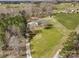 An aerial view displays the property with green space, a tree line and surrounding rural landscape at 260 Charlie Stacks Rd, Lancaster, SC 29720