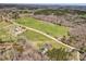 Overhead shot features the home, adjacent fields, pond, and surrounding lush greenery at 260 Charlie Stacks Rd, Lancaster, SC 29720