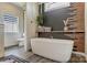 Bright and airy bathroom featuring a freestanding tub, modern fixtures, and stylish decor at 260 Charlie Stacks Rd, Lancaster, SC 29720