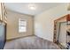 Bedroom features neutral colors, carpeted floors, a window, and a decorative full length mirror at 260 Charlie Stacks Rd, Lancaster, SC 29720