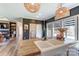 Modern farmhouse kitchen features a large island with a porcelain sink and wooden countertop with wicker light fixtures at 260 Charlie Stacks Rd, Lancaster, SC 29720