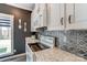 Updated kitchen featuring marble countertops, decorative backsplash, and modern appliances at 260 Charlie Stacks Rd, Lancaster, SC 29720