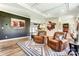 Open-concept living space with a decorative rug, two recliners, and wood-look floors at 260 Charlie Stacks Rd, Lancaster, SC 29720