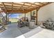 Inviting outdoor patio space with comfortable seating, ceiling fan, and rustic wood beams at 260 Charlie Stacks Rd, Lancaster, SC 29720