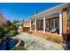 Charming porch with brick, fountain and lovely landscaping at 2622 Sheffield Crescent Ct, Charlotte, NC 28226