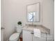 Stylish powder room featuring a granite countertop and decorative greenery at 2622 Sheffield Crescent Ct, Charlotte, NC 28226