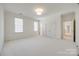 Spacious bedroom featuring plush carpeting and bright natural lighting from large windows at 2622 Sheffield Crescent Ct, Charlotte, NC 28226