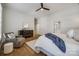 Bright bedroom featuring hardwood floors, a ceiling fan, and an ensuite bathroom at 2622 Sheffield Crescent Ct, Charlotte, NC 28226
