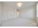 Spacious bedroom featuring plush carpeting and bright natural lighting from large windows at 2622 Sheffield Crescent Ct, Charlotte, NC 28226