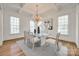 Elegant dining room features coffered ceilings, modern chandelier, and large windows at 2622 Sheffield Crescent Ct, Charlotte, NC 28226