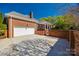 Brick house with white garage and manicured lawn at 2622 Sheffield Crescent Ct, Charlotte, NC 28226