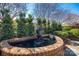 Serene water fountain with lush greenery, creating a peaceful outdoor ambiance at 2622 Sheffield Crescent Ct, Charlotte, NC 28226