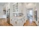 This kitchen is equipped with stainless steel appliances, elegant marble counters, and sleek white cabinets at 2622 Sheffield Crescent Ct, Charlotte, NC 28226