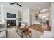 Bright and airy living room boasts a fireplace, built-in shelves, and an open layout leading to the foyer and staircase at 2622 Sheffield Crescent Ct, Charlotte, NC 28226