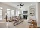 The living room features built-in shelving, a fireplace, and large windows, creating a cozy and inviting atmosphere at 2622 Sheffield Crescent Ct, Charlotte, NC 28226