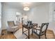 Cozy office with hardwood, soft chairs, desk, and a view through the doorway at 2622 Sheffield Crescent Ct, Charlotte, NC 28226