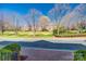 Picturesque street view with mature trees and well-maintained lawns at 2622 Sheffield Crescent Ct, Charlotte, NC 28226