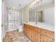 Bathroom featuring a vanity with solid countertop, a glass enclosed shower at 2905 Polo View Ln, Matthews, NC 28105