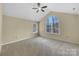 Neutral bedroom with a vaulted ceiling, ceiling fan and natural light at 2905 Polo View Ln, Matthews, NC 28105