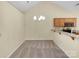 Cozy dining area with modern lighting fixture and convenient breakfast bar at 2905 Polo View Ln, Matthews, NC 28105