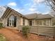 Charming home with stone accents, a well-maintained yard, and a inviting entryway at 2905 Polo View Ln, Matthews, NC 28105