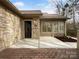 Attractive home exterior with a brick patio, stone accents, and meticulous landscaping at 2905 Polo View Ln, Matthews, NC 28105