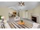 Bright living room with a fireplace, neutral colors, and an open floor plan at 2905 Polo View Ln, Matthews, NC 28105