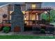Cozy deck with stone fireplace and pergola, perfect for outdoor entertaining at 3017 Chisholm Ct, Waxhaw, NC 28173