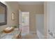 Bathroom with granite countertop vanity, bathtub, and tiled floor, showcasing a functional and clean space at 3017 Chisholm Ct, Waxhaw, NC 28173