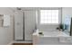 Bathroom boasts a tub and a glass-enclosed shower, providing modern comfort at 3017 Chisholm Ct, Waxhaw, NC 28173
