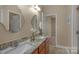 Bathroom with double granite sinks, tile floor, and stylish fixtures, offering a luxurious feel at 3017 Chisholm Ct, Waxhaw, NC 28173