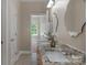 Bathroom with double vanity featuring granite countertops and modern sinks at 3017 Chisholm Ct, Waxhaw, NC 28173