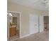 Bedroom with ceiling fan, carpet, and doors leading to a bathroom and a hallway at 3017 Chisholm Ct, Waxhaw, NC 28173