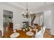 Charming dining room with a wooden table, white chairs, and plenty of natural light at 3017 Chisholm Ct, Waxhaw, NC 28173