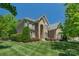 Elegant brick home with manicured landscaping, offering great curb appeal at 3017 Chisholm Ct, Waxhaw, NC 28173