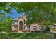 Charming brick home with a well-kept lawn and mature trees providing shade at 3017 Chisholm Ct, Waxhaw, NC 28173