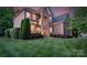 Beautiful brick home with a well-maintained lawn and carefully trimmed shrubs at 3017 Chisholm Ct, Waxhaw, NC 28173