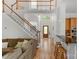 Grand foyer entrance with hardwood floors and open staircase at 3017 Chisholm Ct, Waxhaw, NC 28173