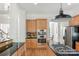 Chef's kitchen showcases stainless steel appliances and ample counter space at 3017 Chisholm Ct, Waxhaw, NC 28173