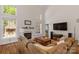 Spacious living room with fireplace and large windows offering natural light at 3017 Chisholm Ct, Waxhaw, NC 28173