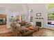 Open living space connecting to the kitchen with fireplace at 3017 Chisholm Ct, Waxhaw, NC 28173