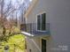 Exterior shot of a private balcony that includes a glass sliding door and black iron railings at 306 7Th Street Ne Pl, Conover, NC 28613