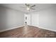 Spacious bedroom featuring a ceiling fan, wood-look flooring, and closet with ample storage at 306 7Th Street Ne Pl, Conover, NC 28613