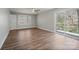 Bedroom features hardwood floors, neutral paint, ceiling fan, and private balcony access at 306 7Th Street Ne Pl, Conover, NC 28613
