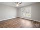 Bedroom features hardwood floors, a ceiling fan, freshly painted walls, and natural light at 306 7Th Street Ne Pl, Conover, NC 28613