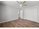 Spacious bedroom features hardwood floors, a ceiling fan, and a closet with double doors at 306 7Th Street Ne Pl, Conover, NC 28613