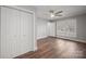 Spacious bedroom with generous closet space, light gray paint and hardwood floors at 306 7Th Street Ne Pl, Conover, NC 28613