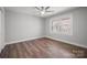 Bright bedroom with ceiling fan, hardwood floors, and large windows offering natural light at 306 7Th Street Ne Pl, Conover, NC 28613