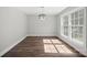 Bright dining room featuring a modern chandelier and large windows providing natural light at 306 7Th Street Ne Pl, Conover, NC 28613