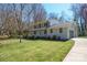 Charming two-story home with a well-manicured lawn and attached garage at 306 7Th Street Ne Pl, Conover, NC 28613